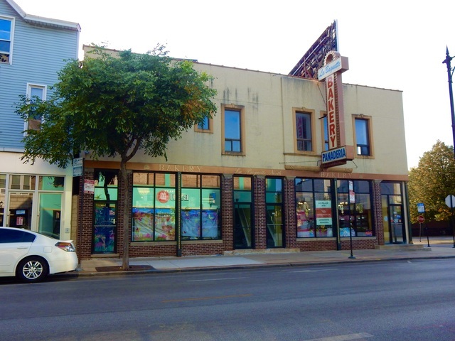 a view of a building with a street