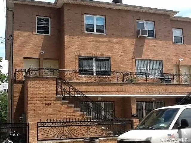 a view of a brick building with many windows