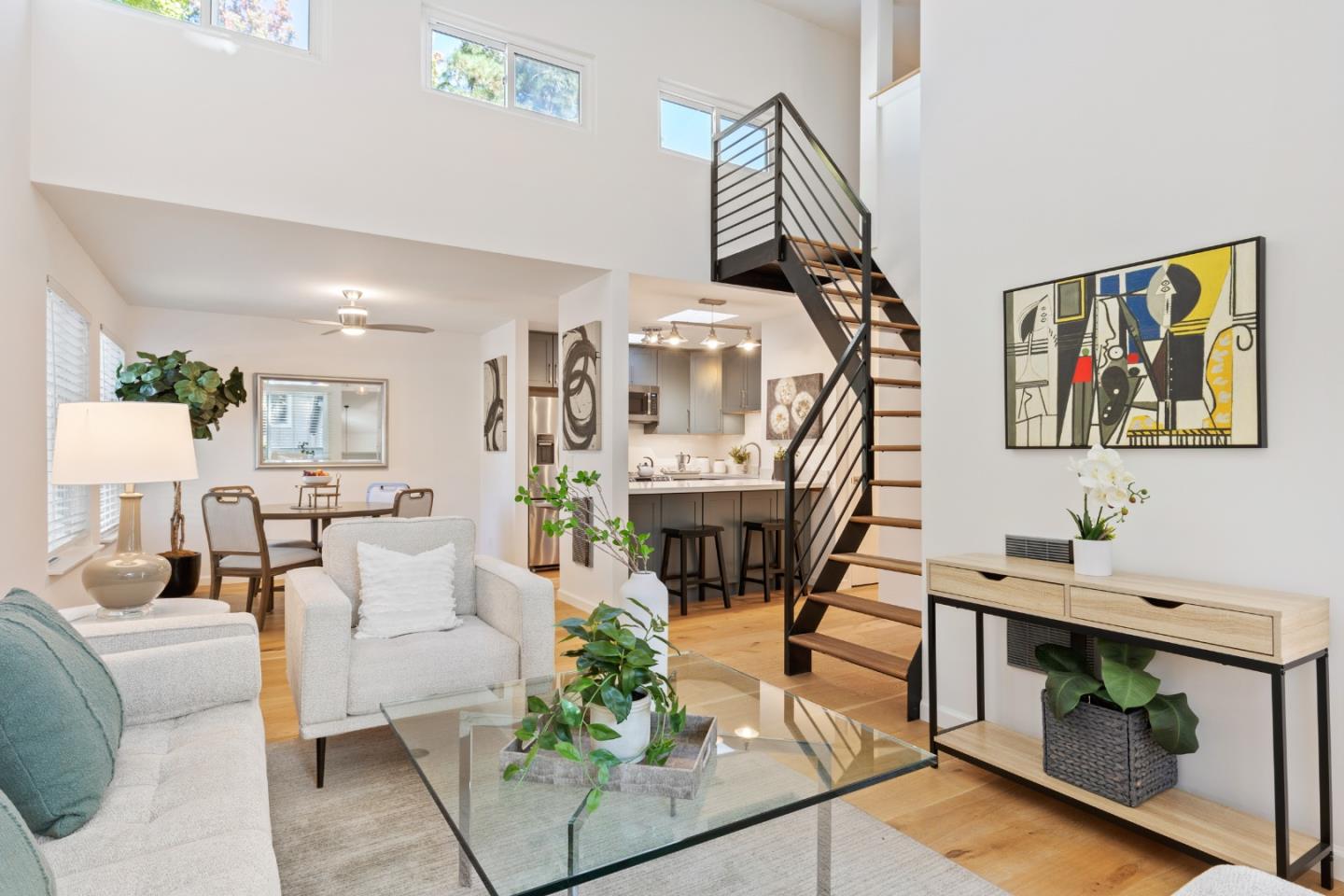 a living room with furniture a rug and a chandelier