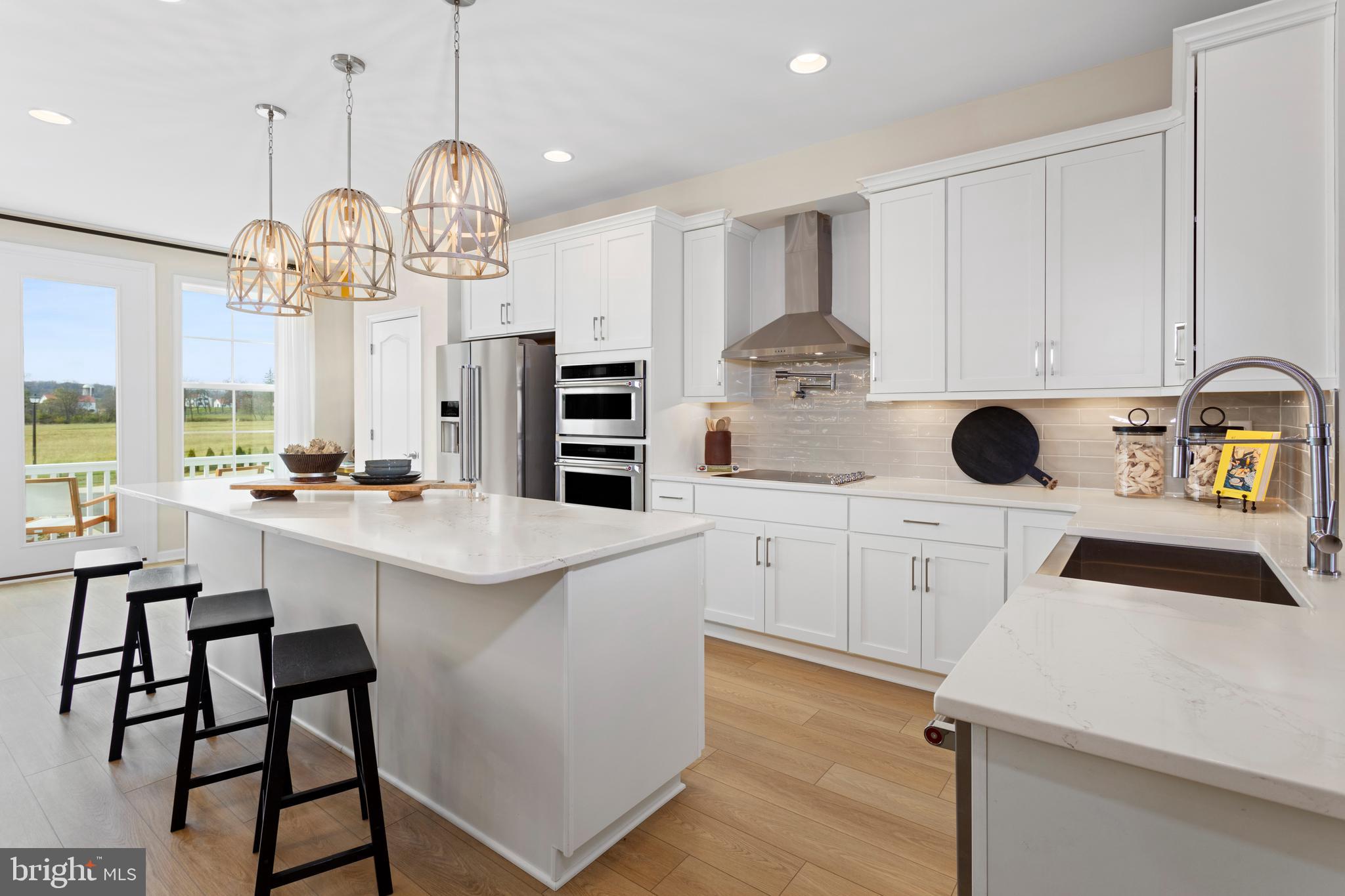 a kitchen with a sink cabinets and window