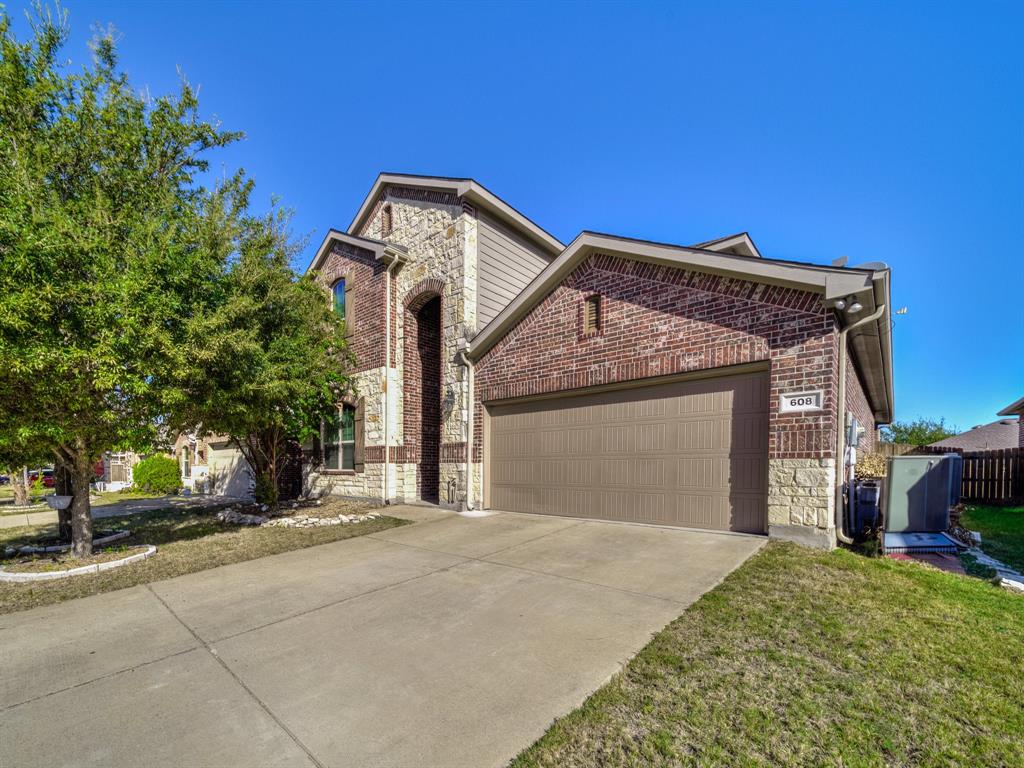 a front view of a house with a garage