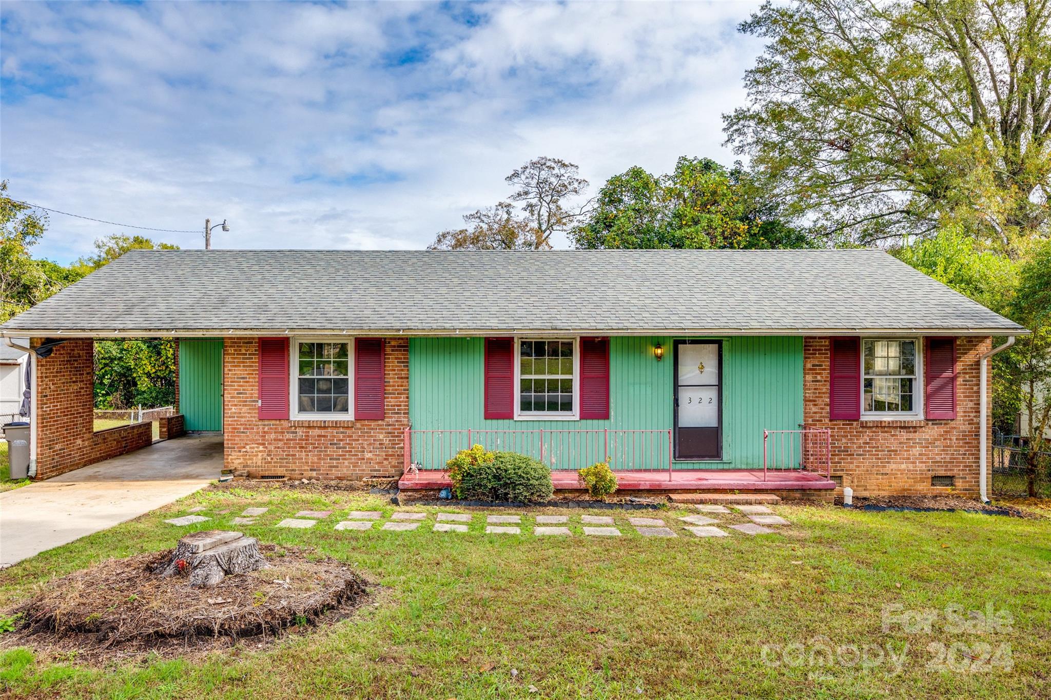 a front view of a house with garden