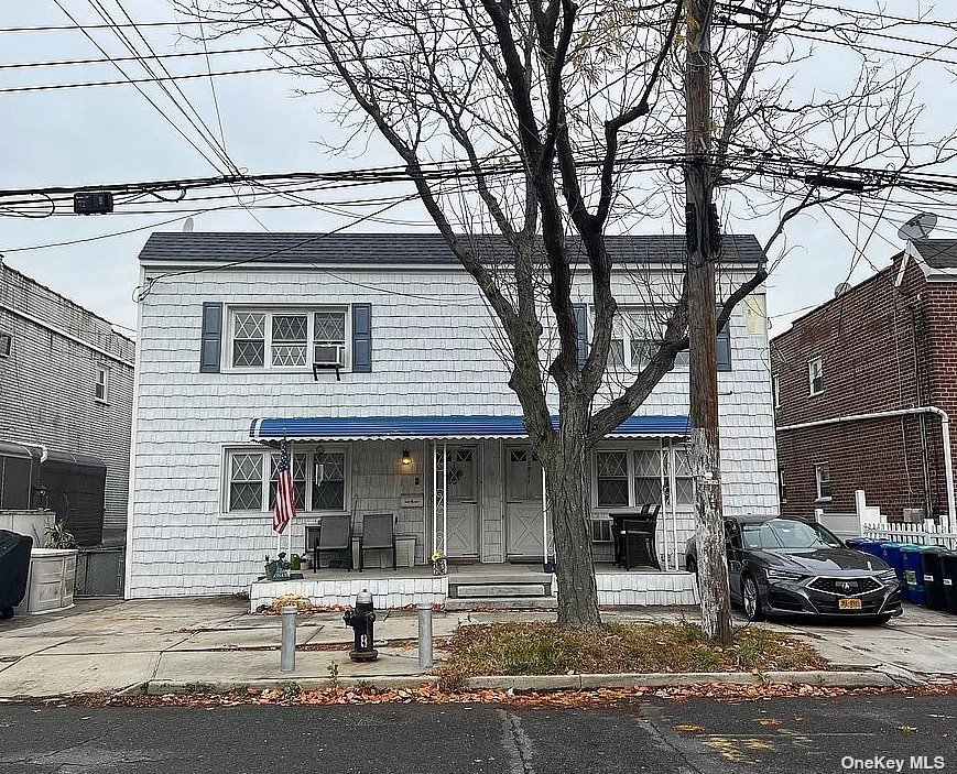 a front view of a house with entrance gate