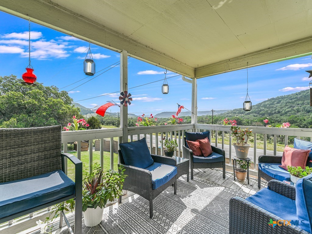 a outdoor living space with furniture and a potted plant