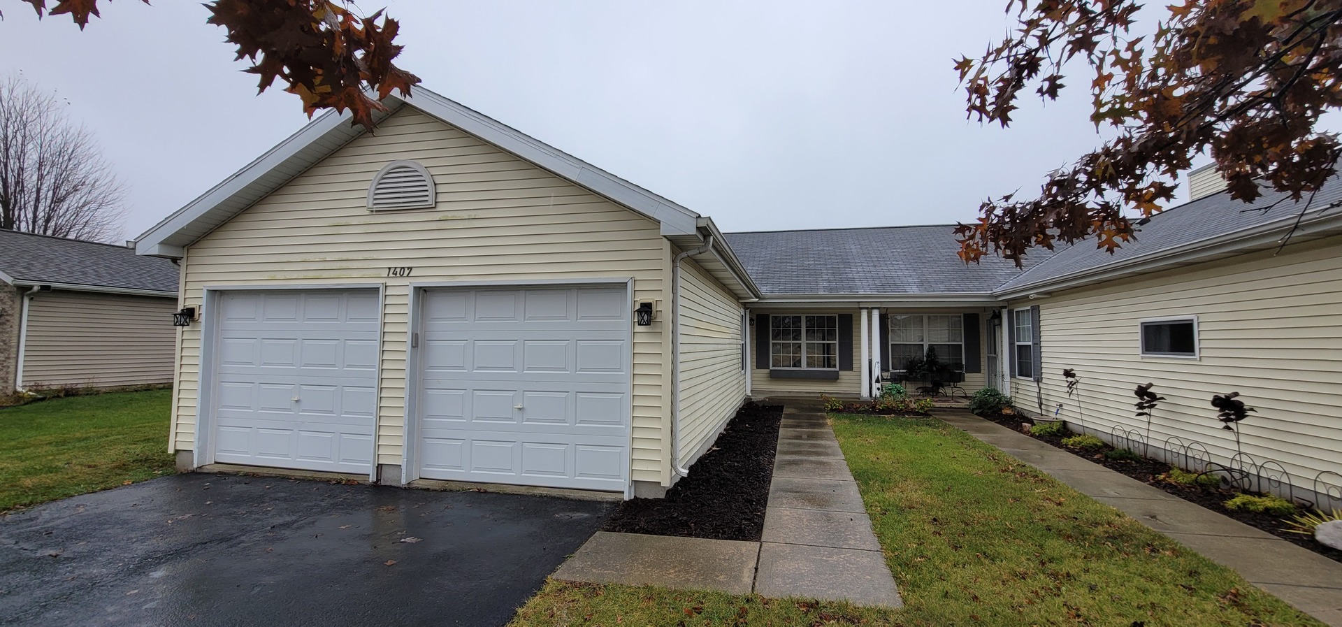 a front view of a house with a yard