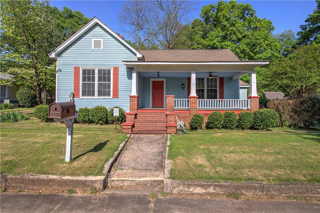 front view of a house with a yard