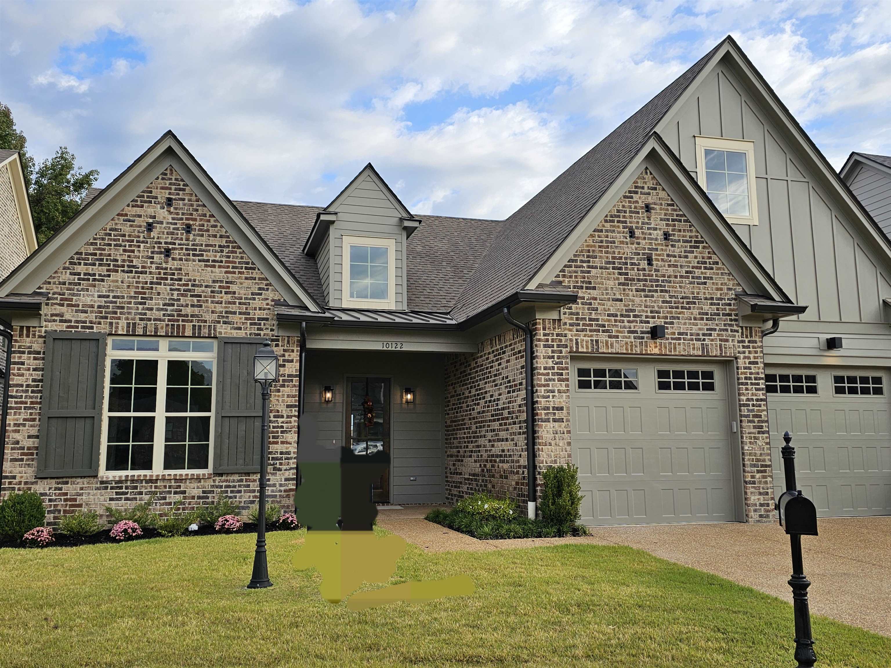 View of front of property with a front yard