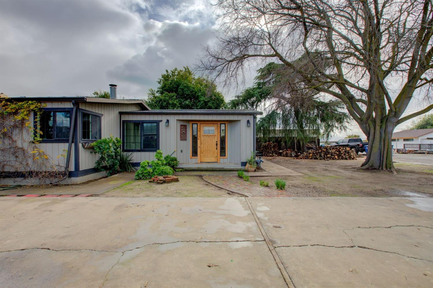 a view of house with outdoor space and shower view