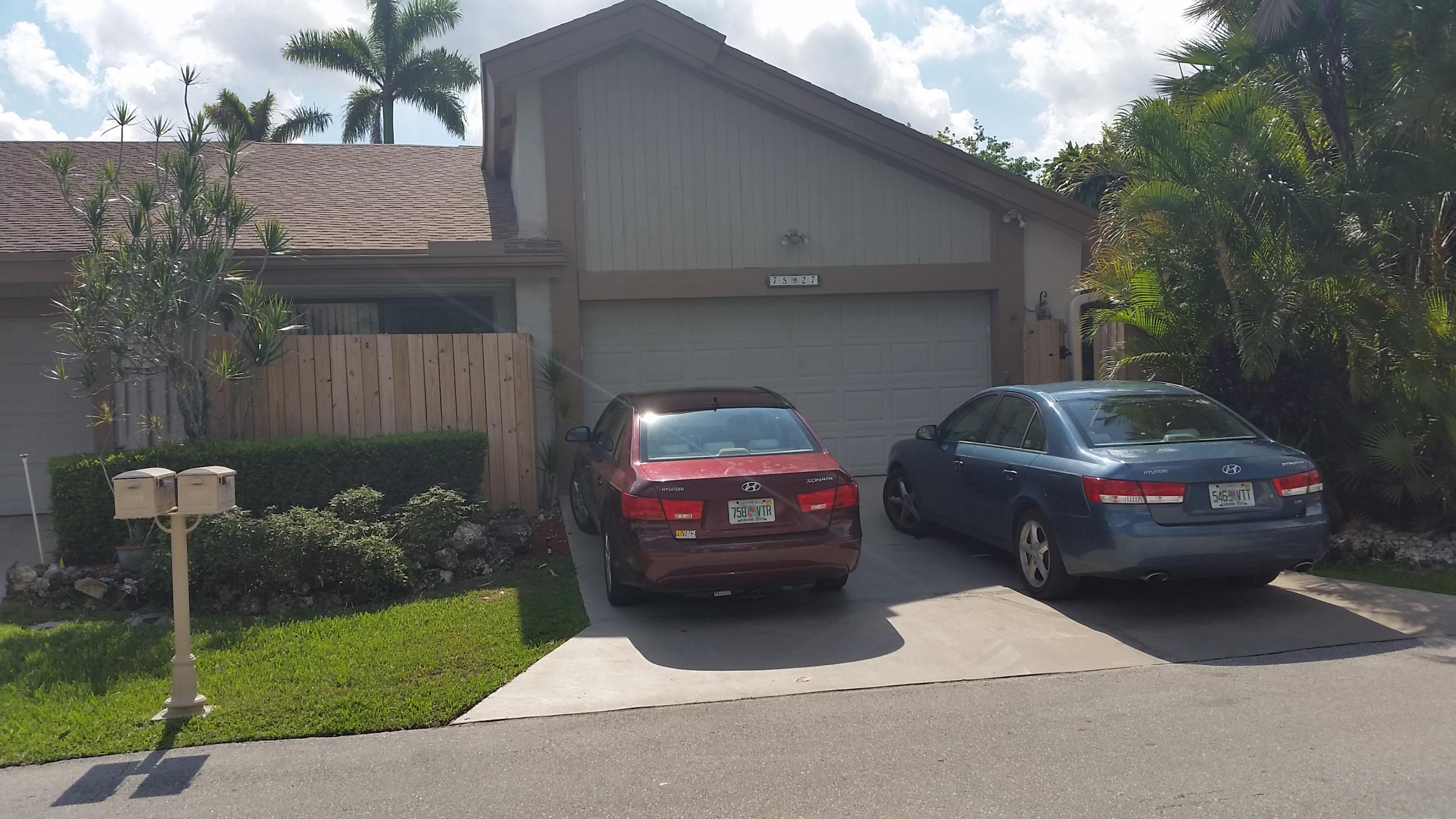 a view of a car parked in front of a house