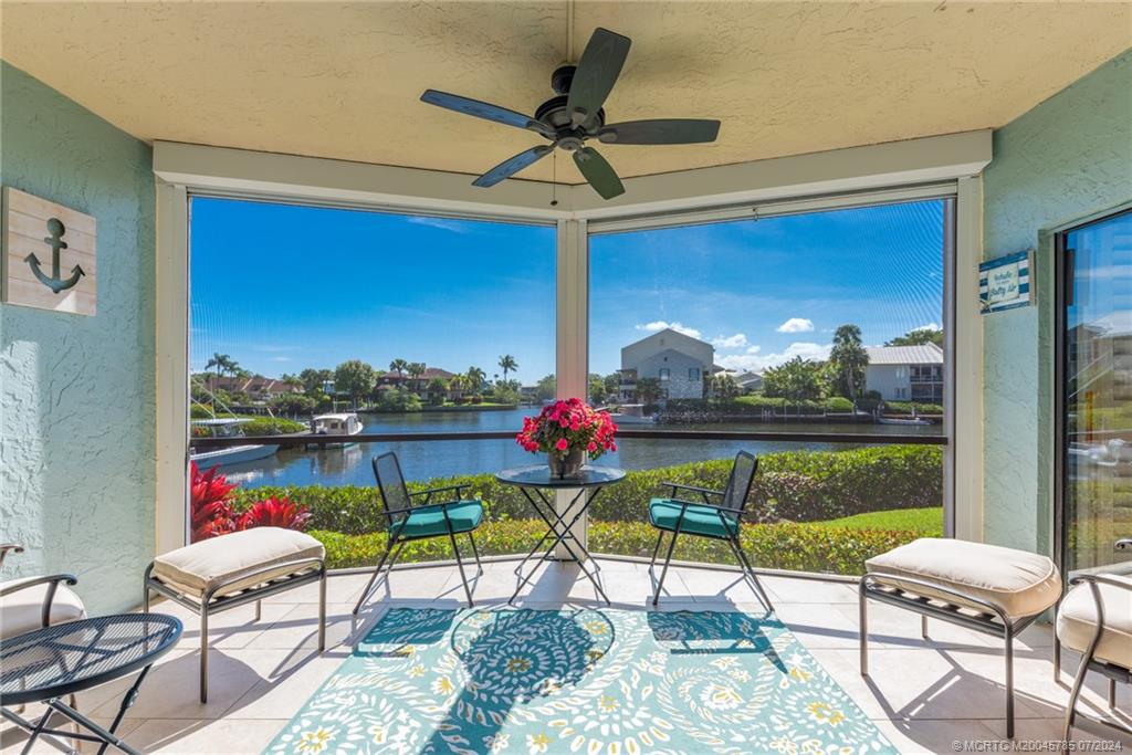 a view of a chairs and table in a patio