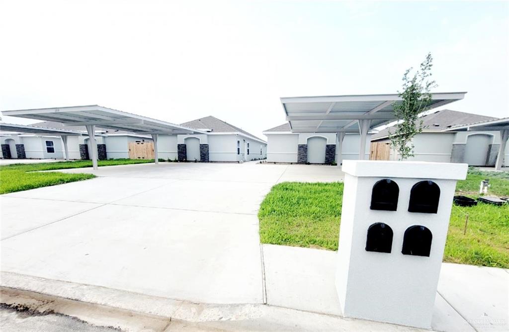 View of front of property featuring a carport