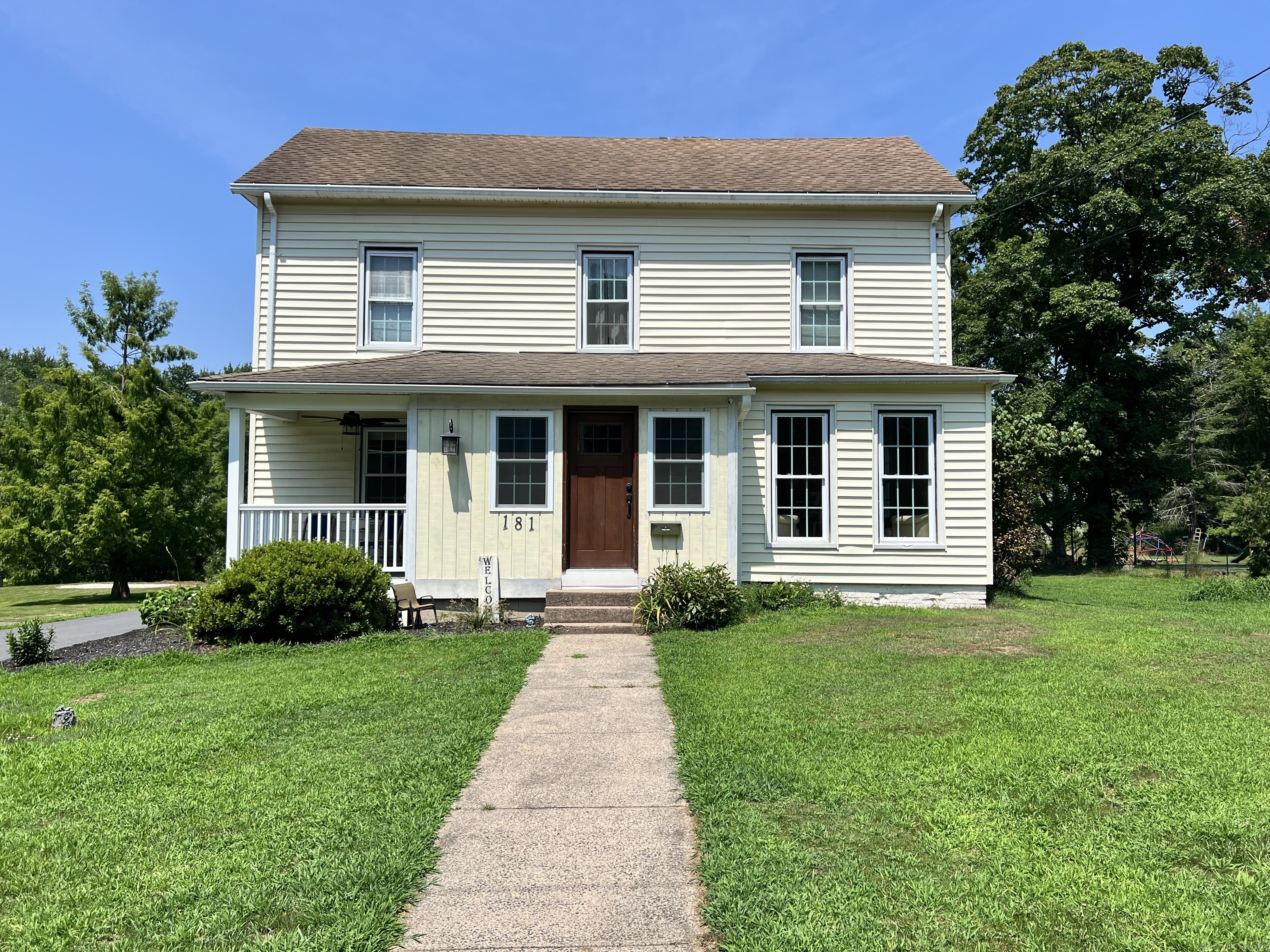 a front view of a house with a yard