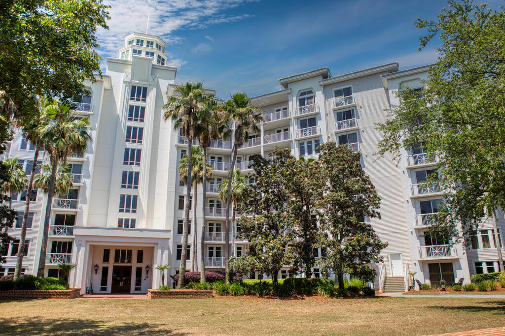 front view of a building with a garden