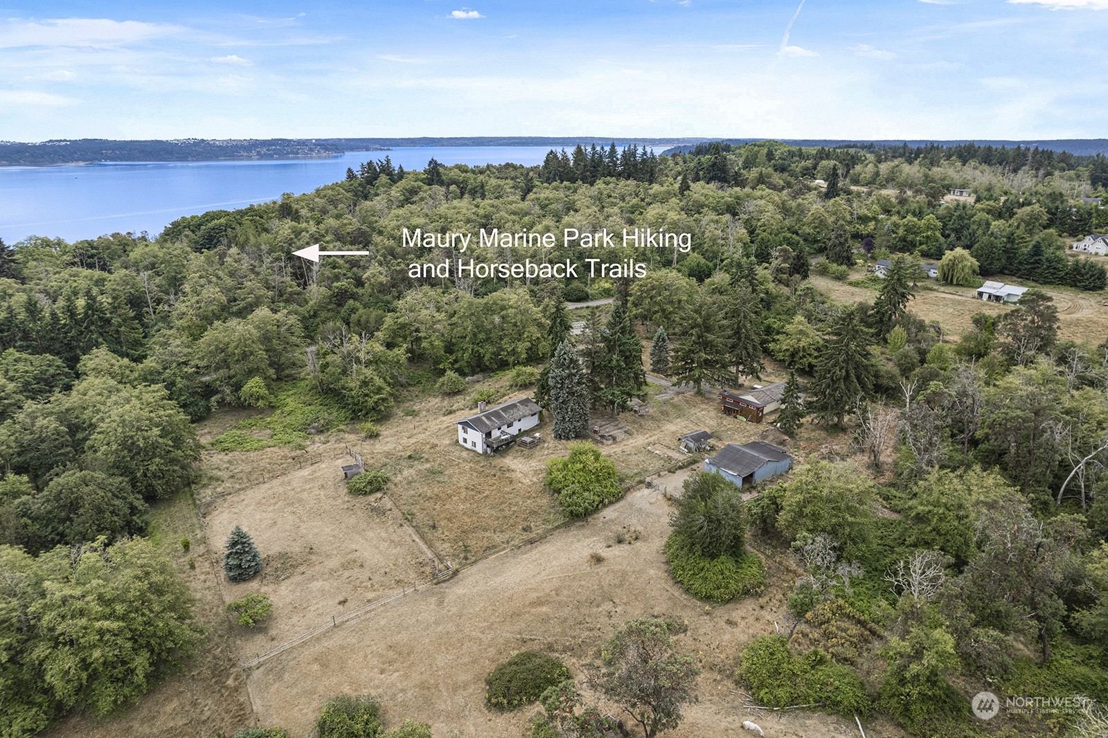 an aerial view of a houses with a yard