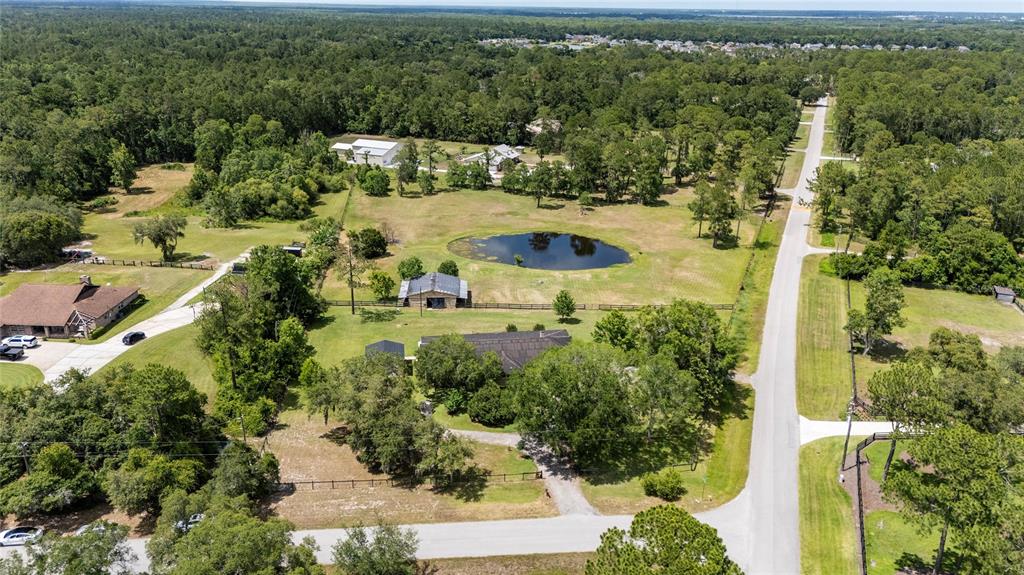 an aerial view of residential house with outdoor space