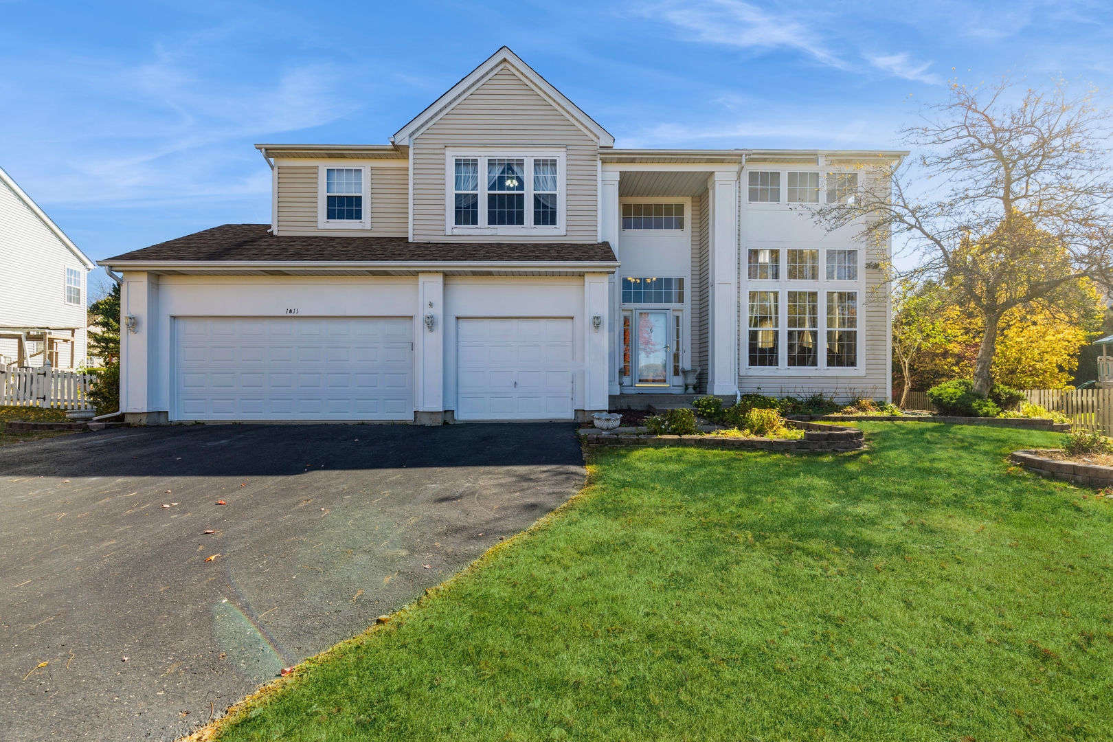 a front view of a house with a yard