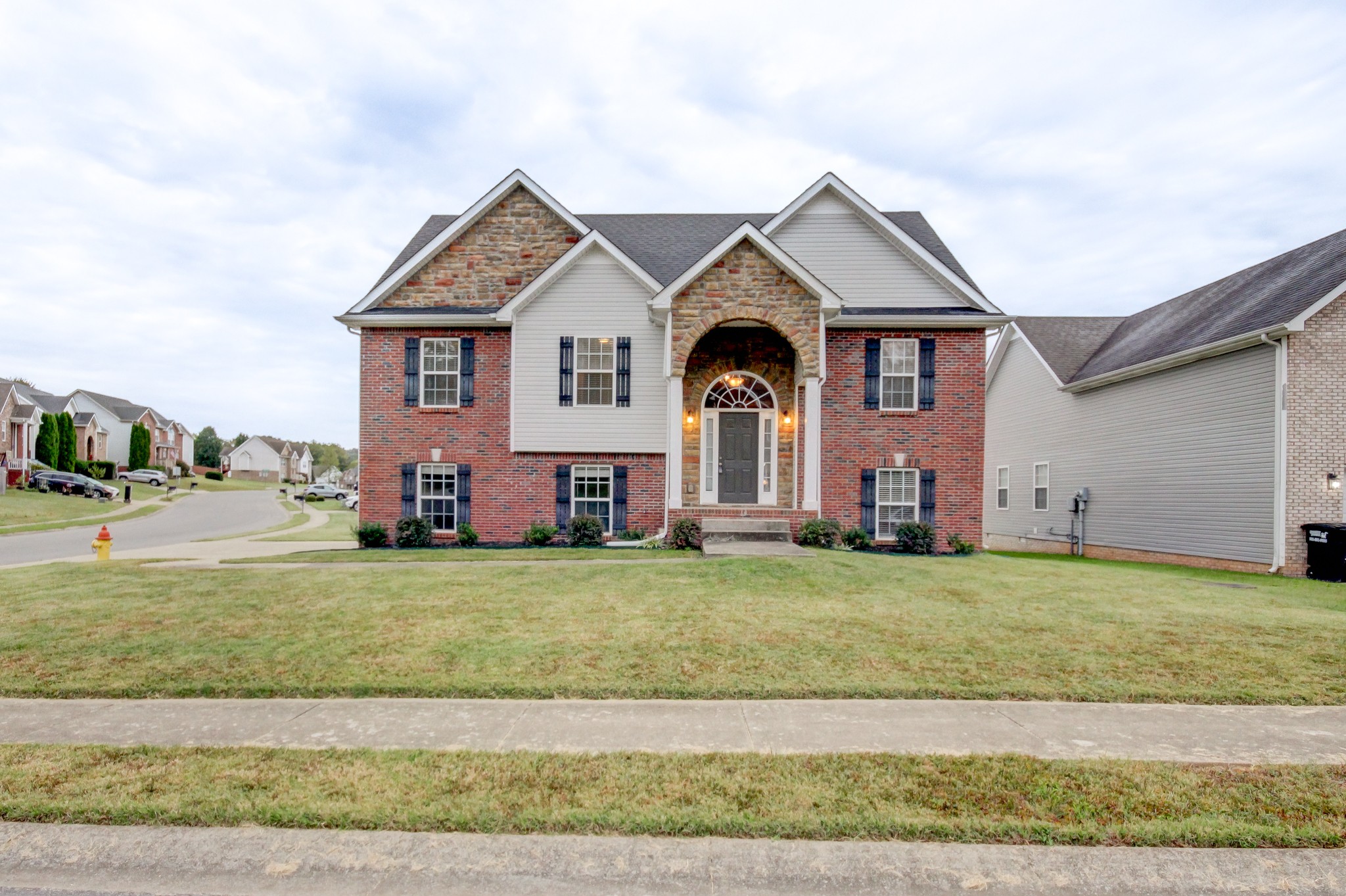 a front view of a house with a yard