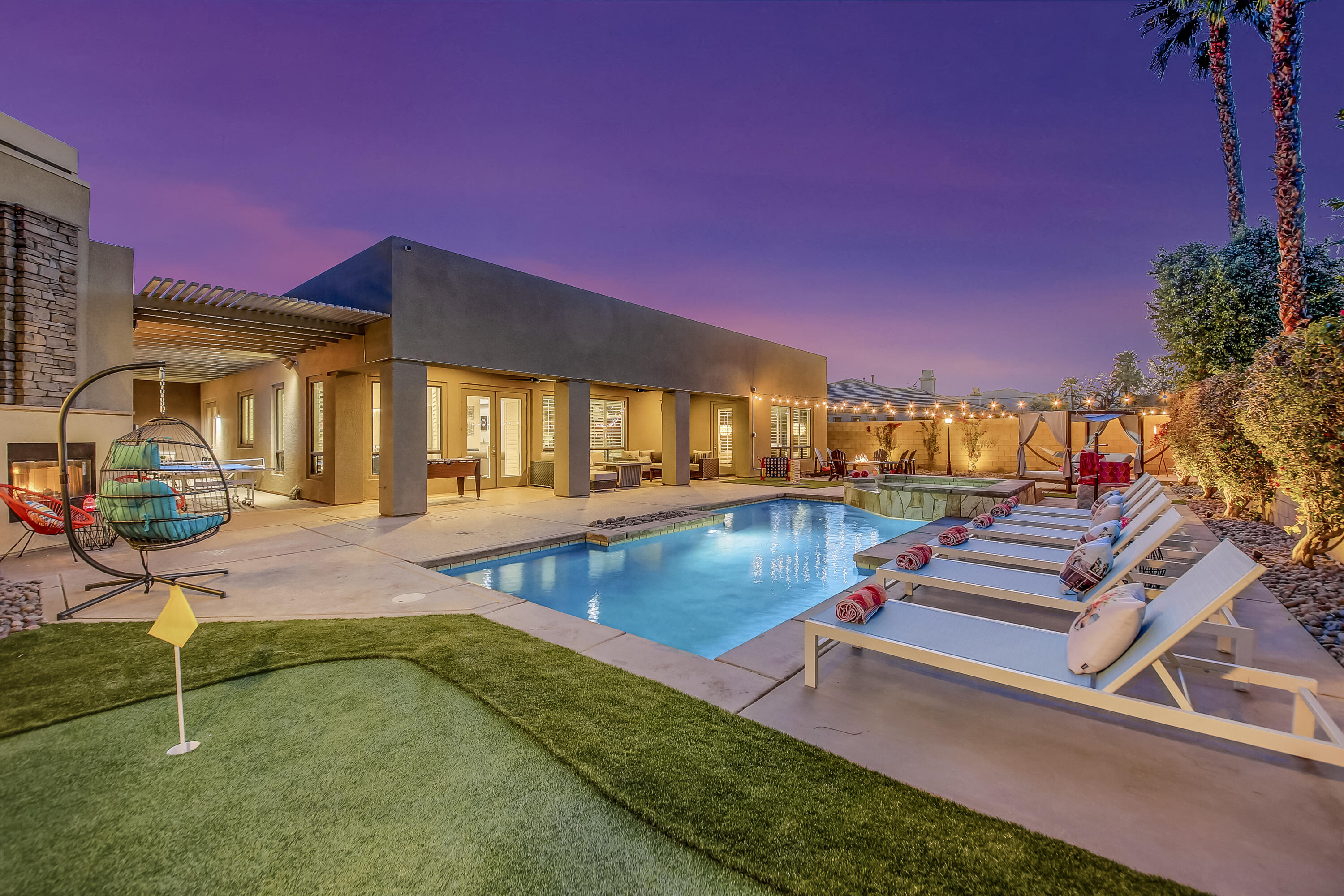 a view of a swimming pool with a lounge chairs