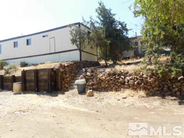 a view of wooden fence of a house