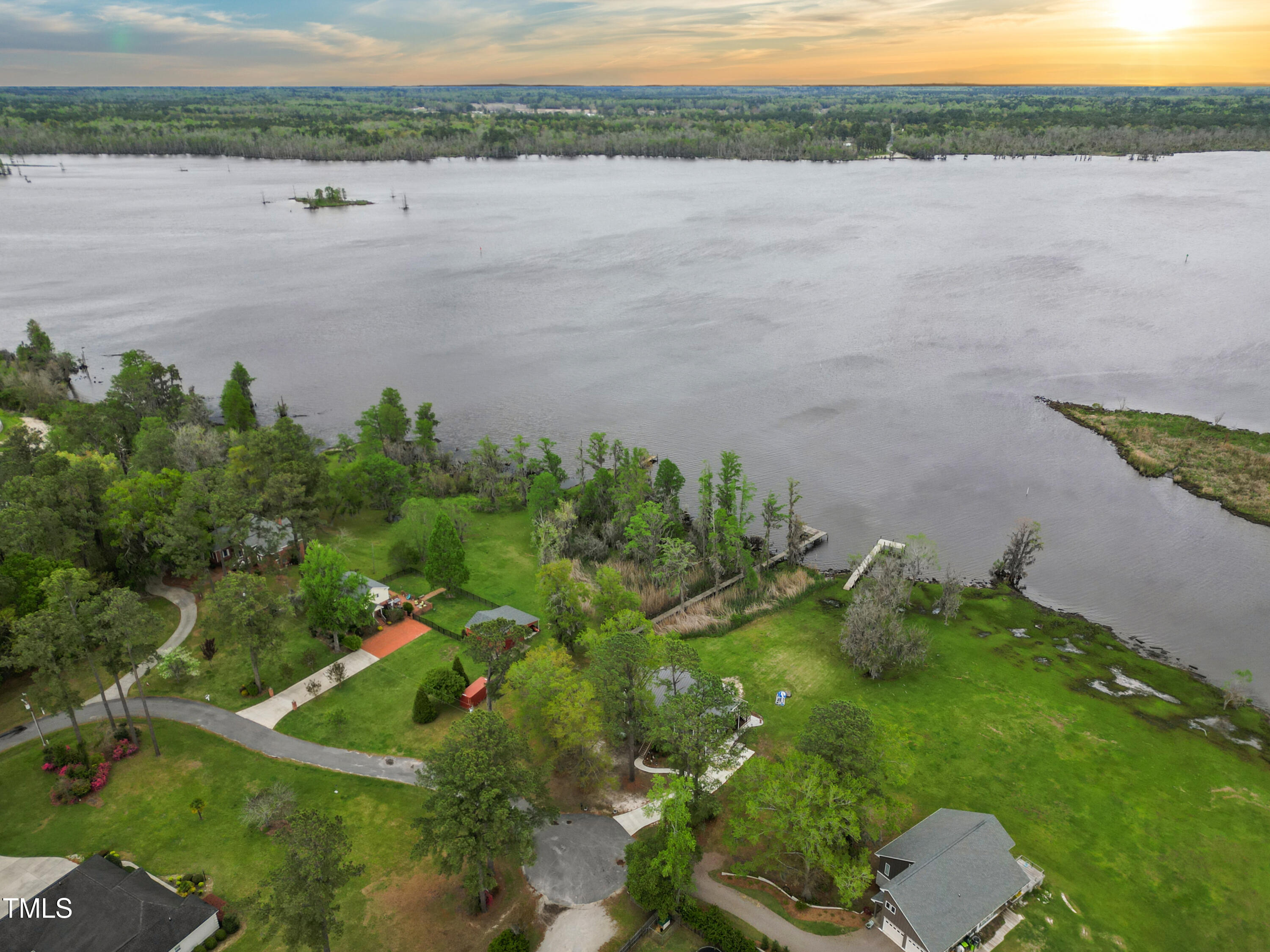 a view of a lake with a yard