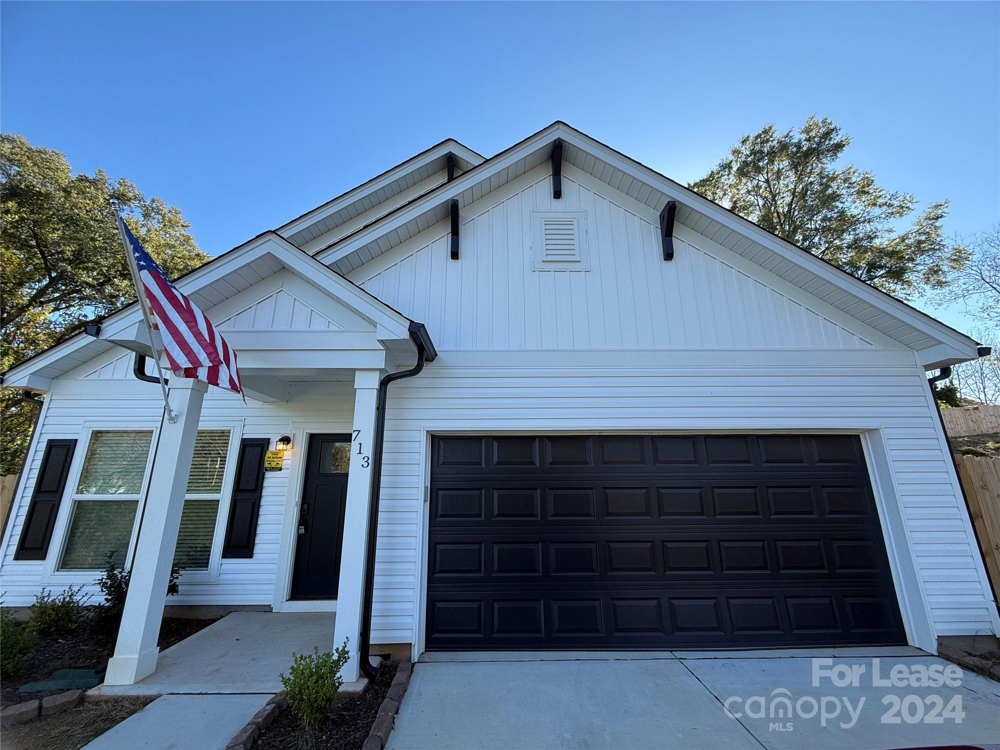 a front view of a house with a garage