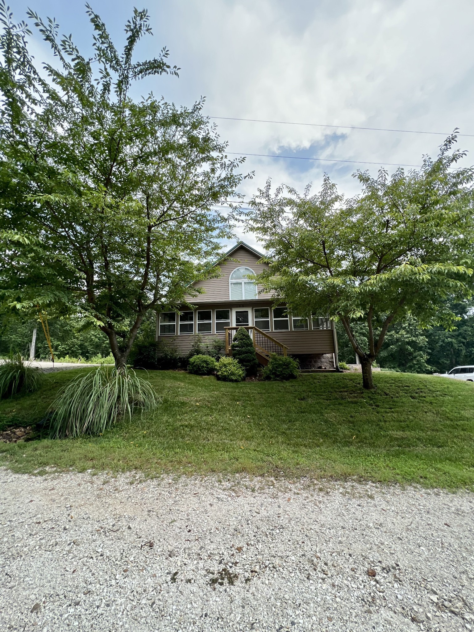 a front view of a house with a yard