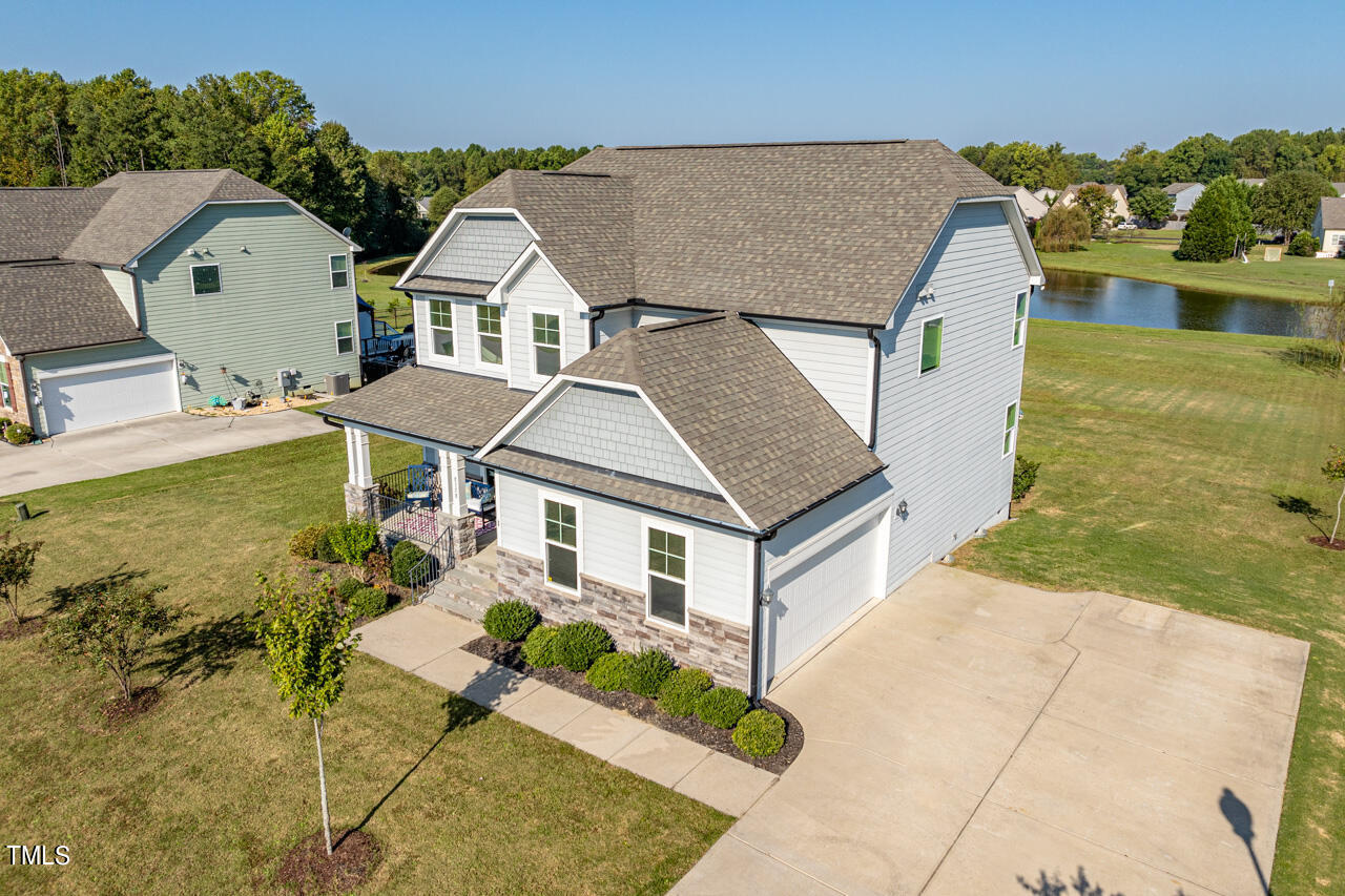 an aerial view of a house with swimming pool