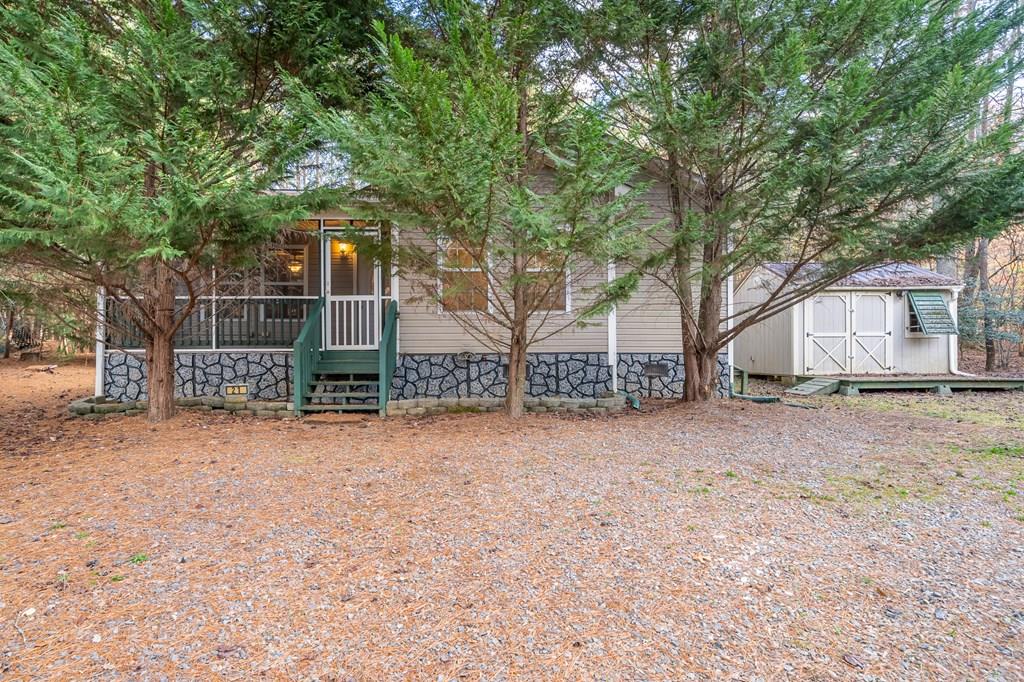 a view of a house with a yard and garage