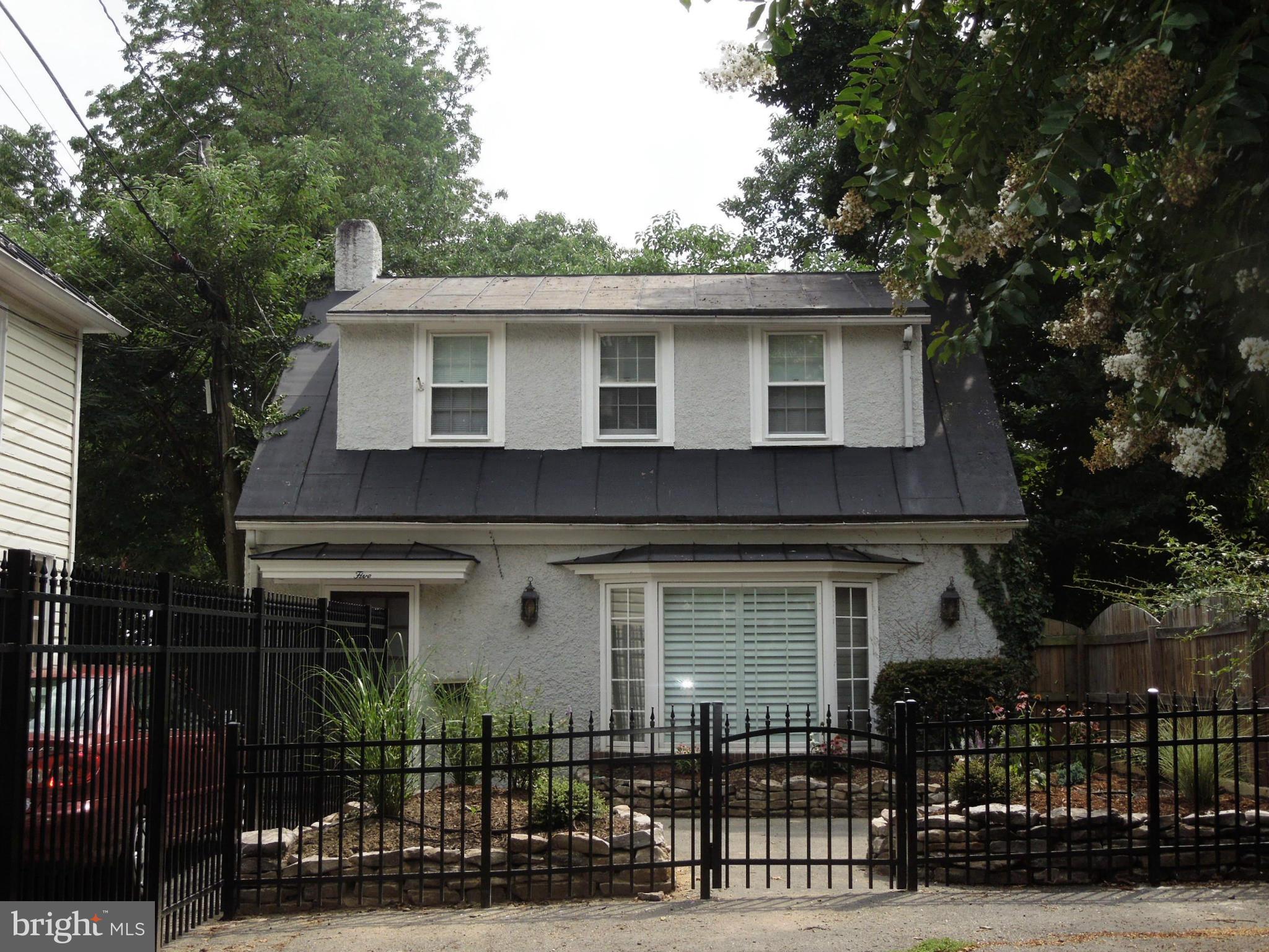 a front view of a house with garage