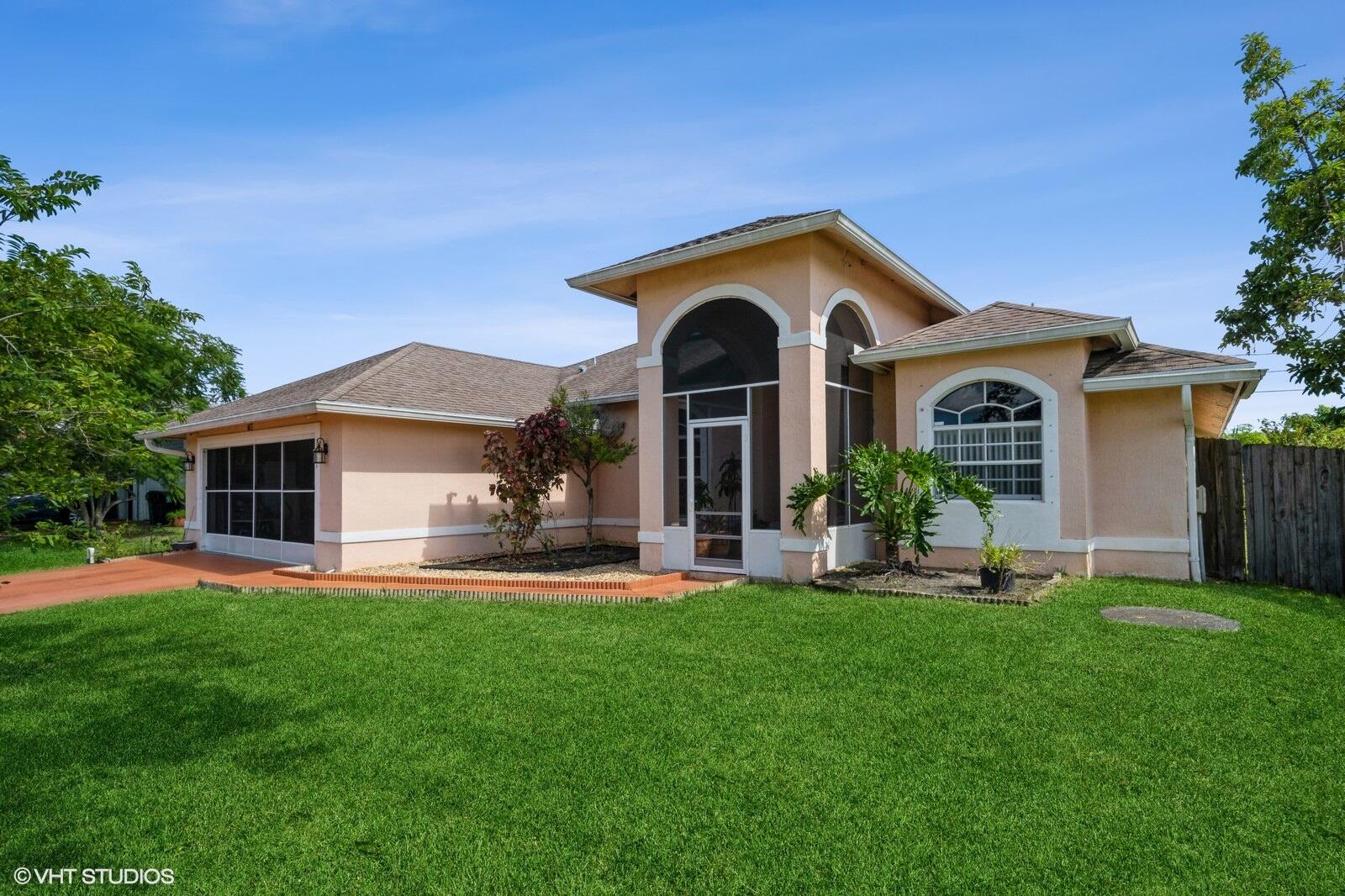 a front view of a house with a yard and porch