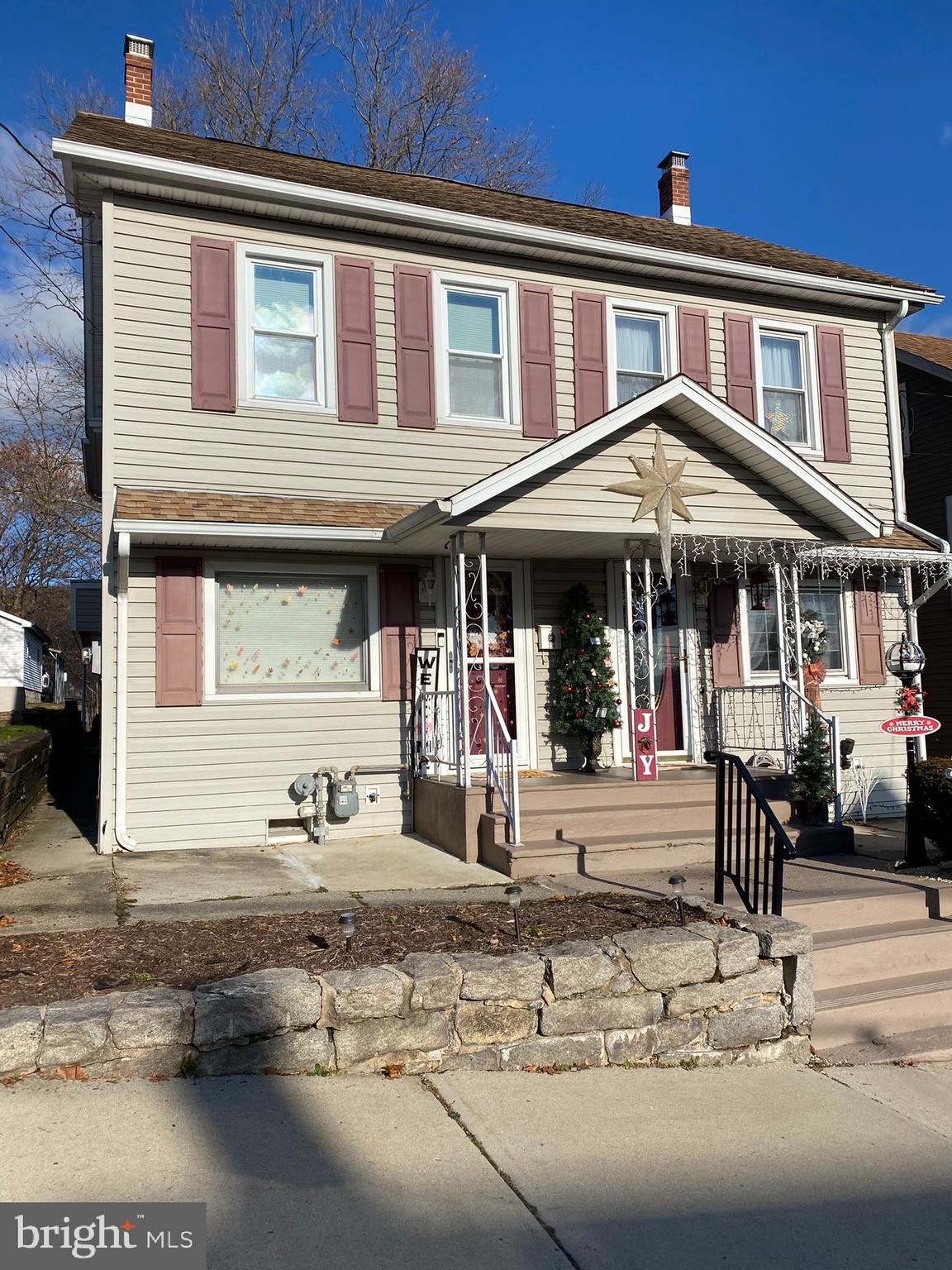 a front view of a house with a porch