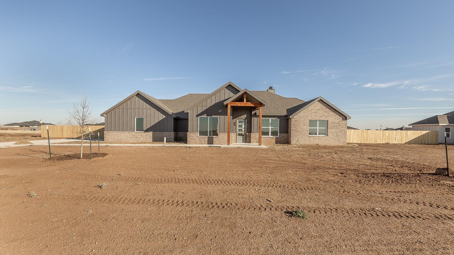 a view of house and yard