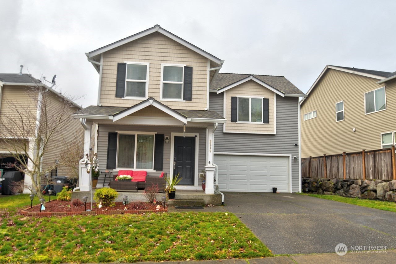 a front view of a house with garden