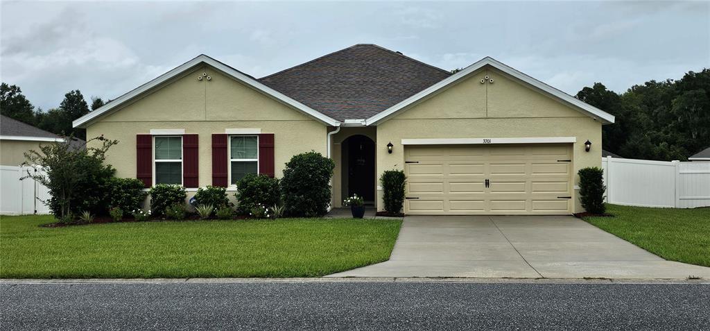 a view of a yard in front view of a house