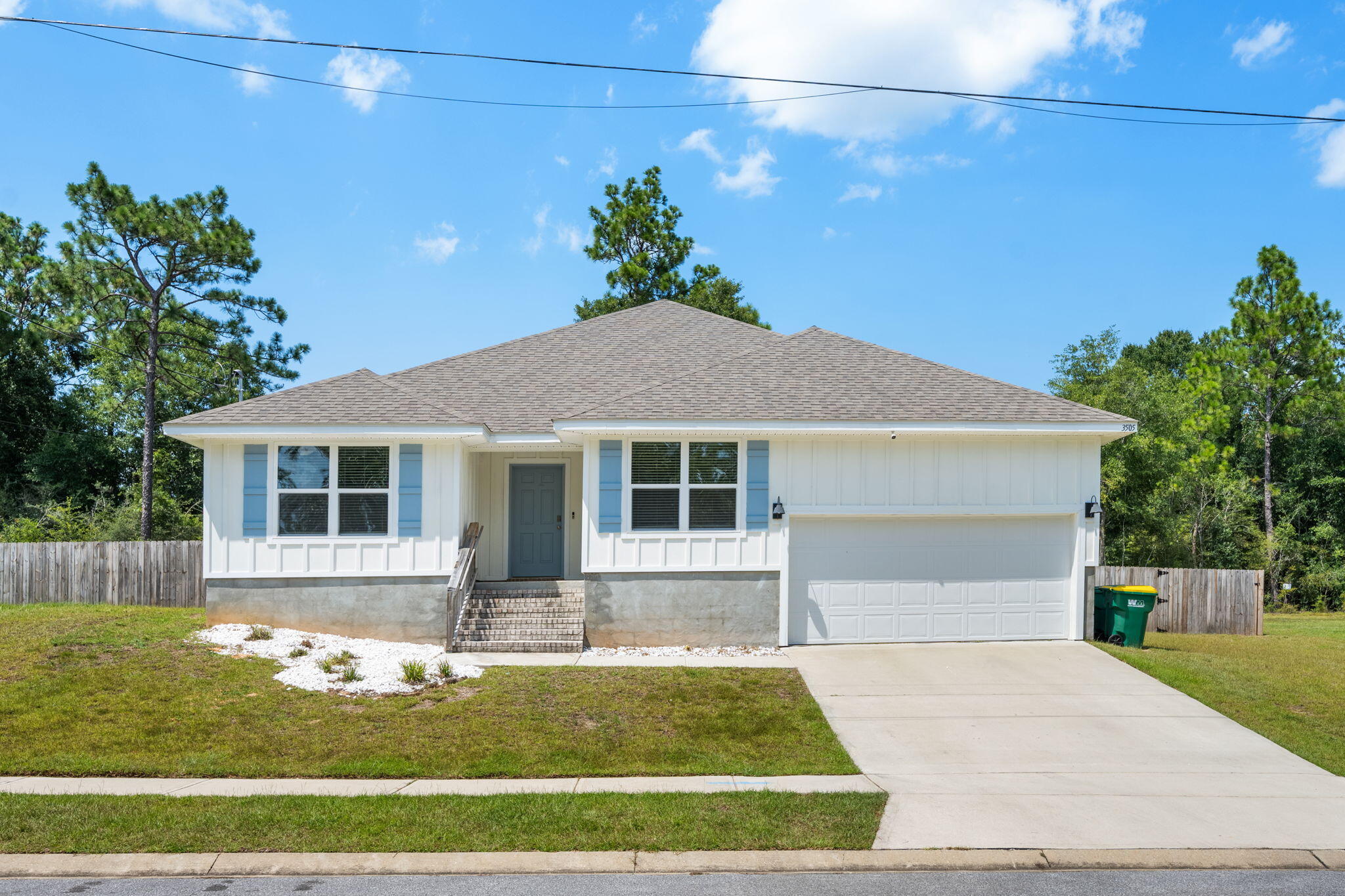 a front view of a house with garden