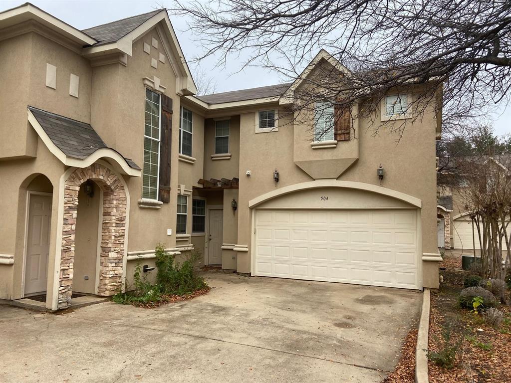 a front view of a house with garage