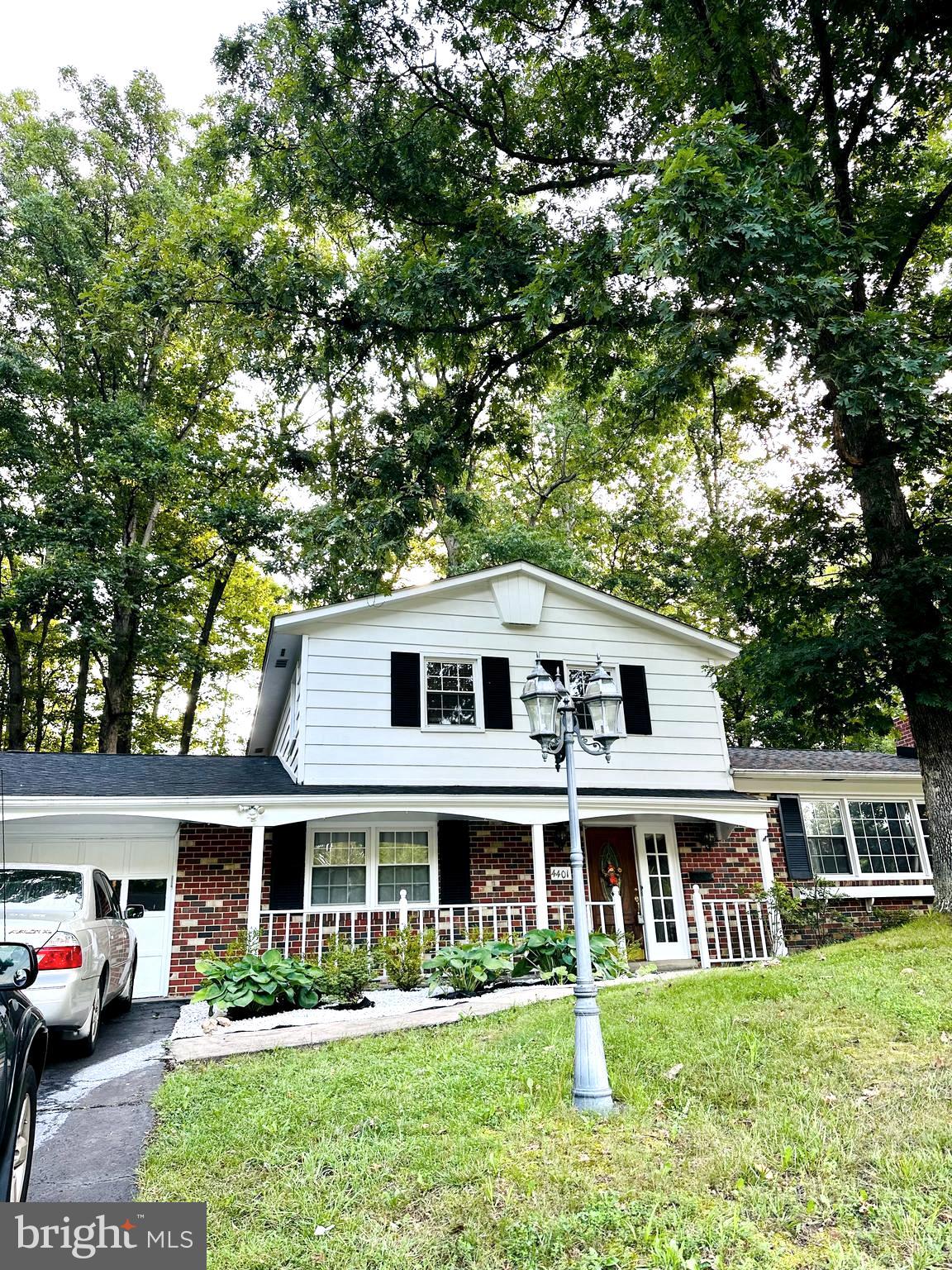 a front view of a house with a yard table and chairs