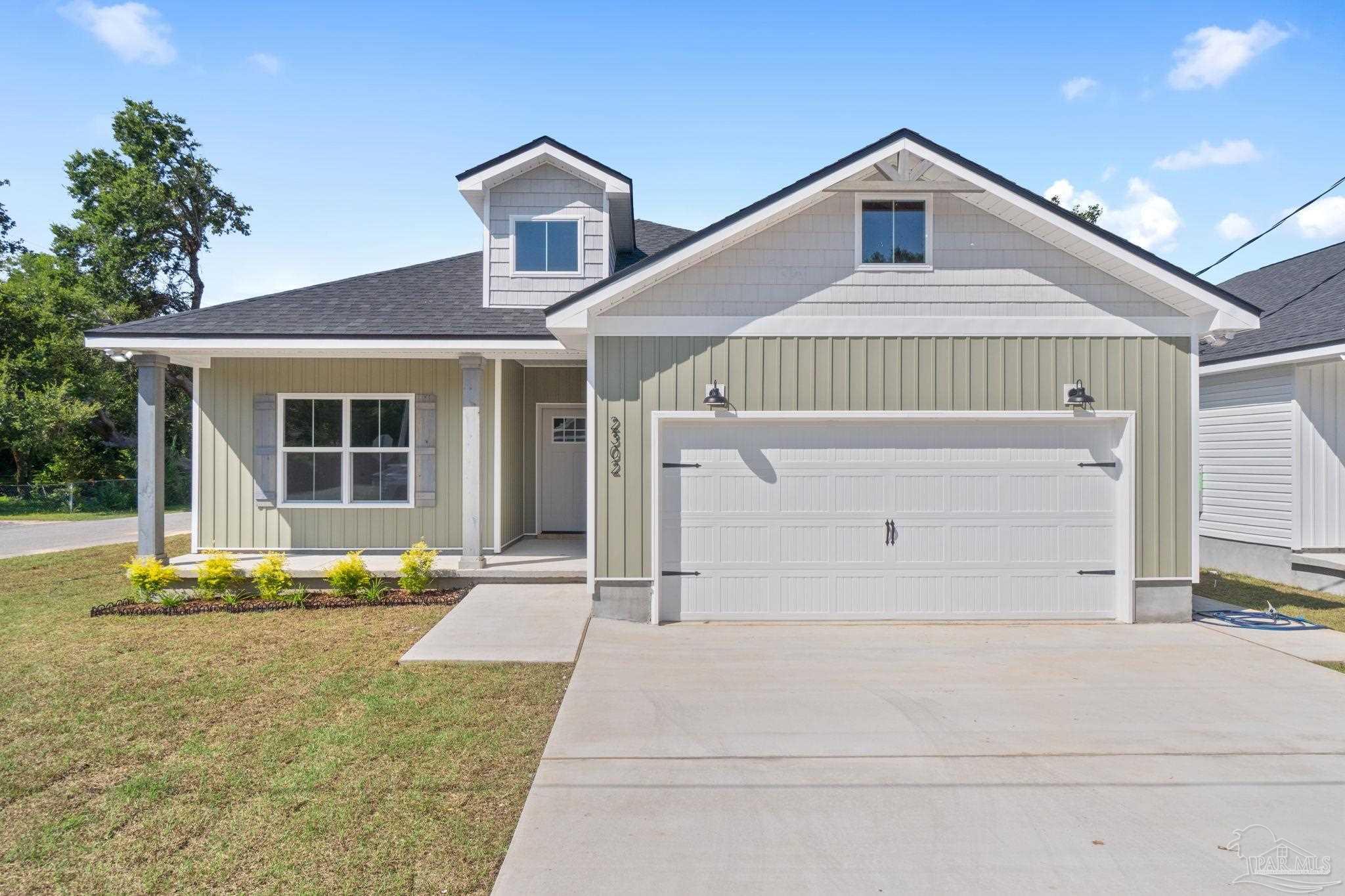 a front view of a house with a garage