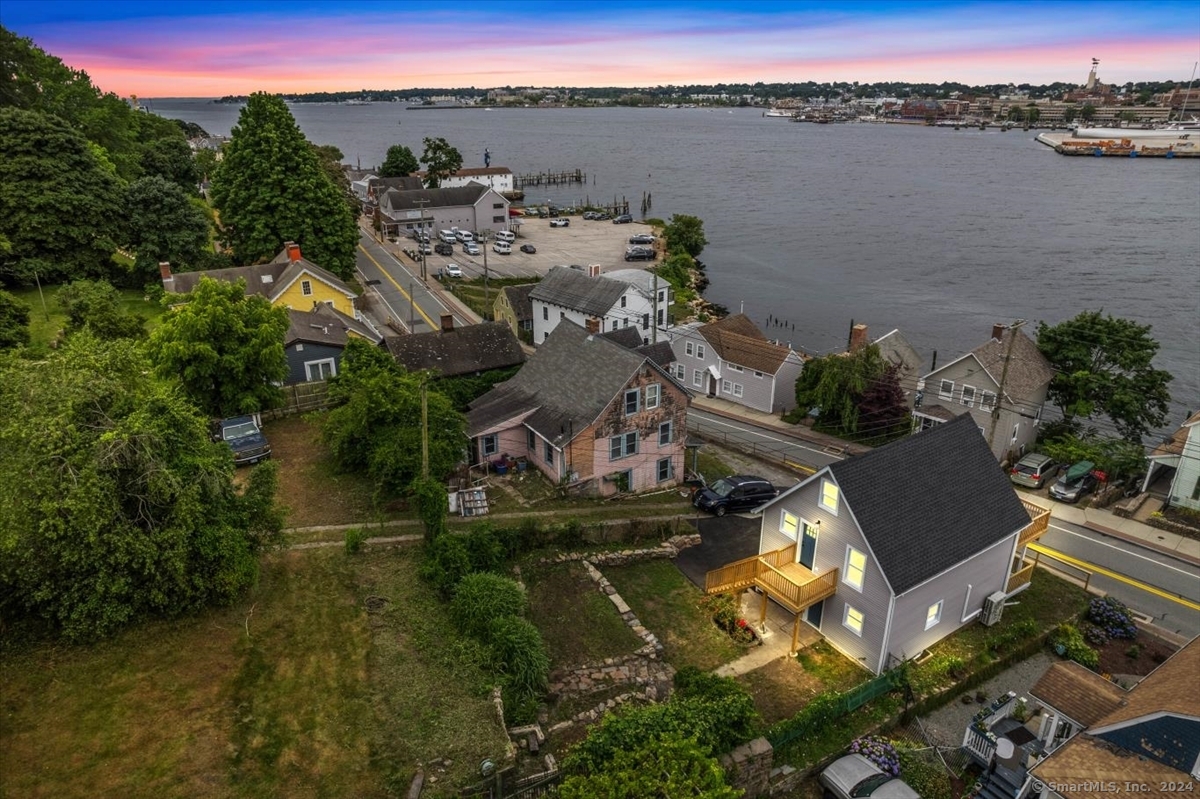 an aerial view of a house with a lake view