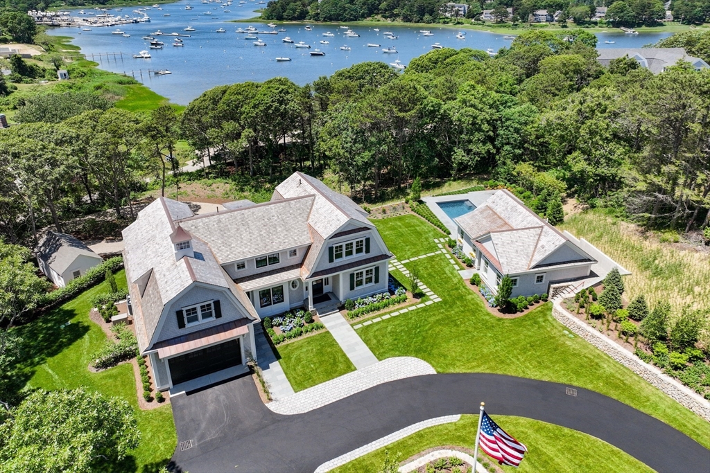 an aerial view of a house with swimming pool garden and outdoor seating