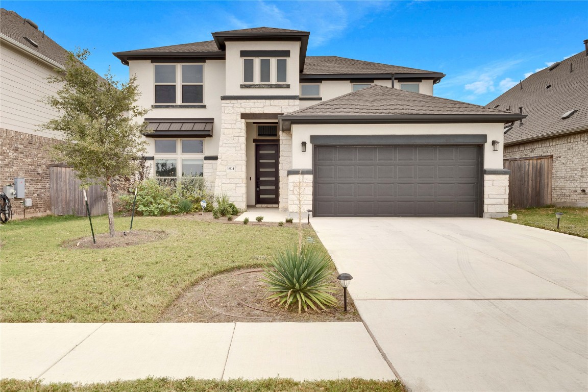 a front view of a house with a yard