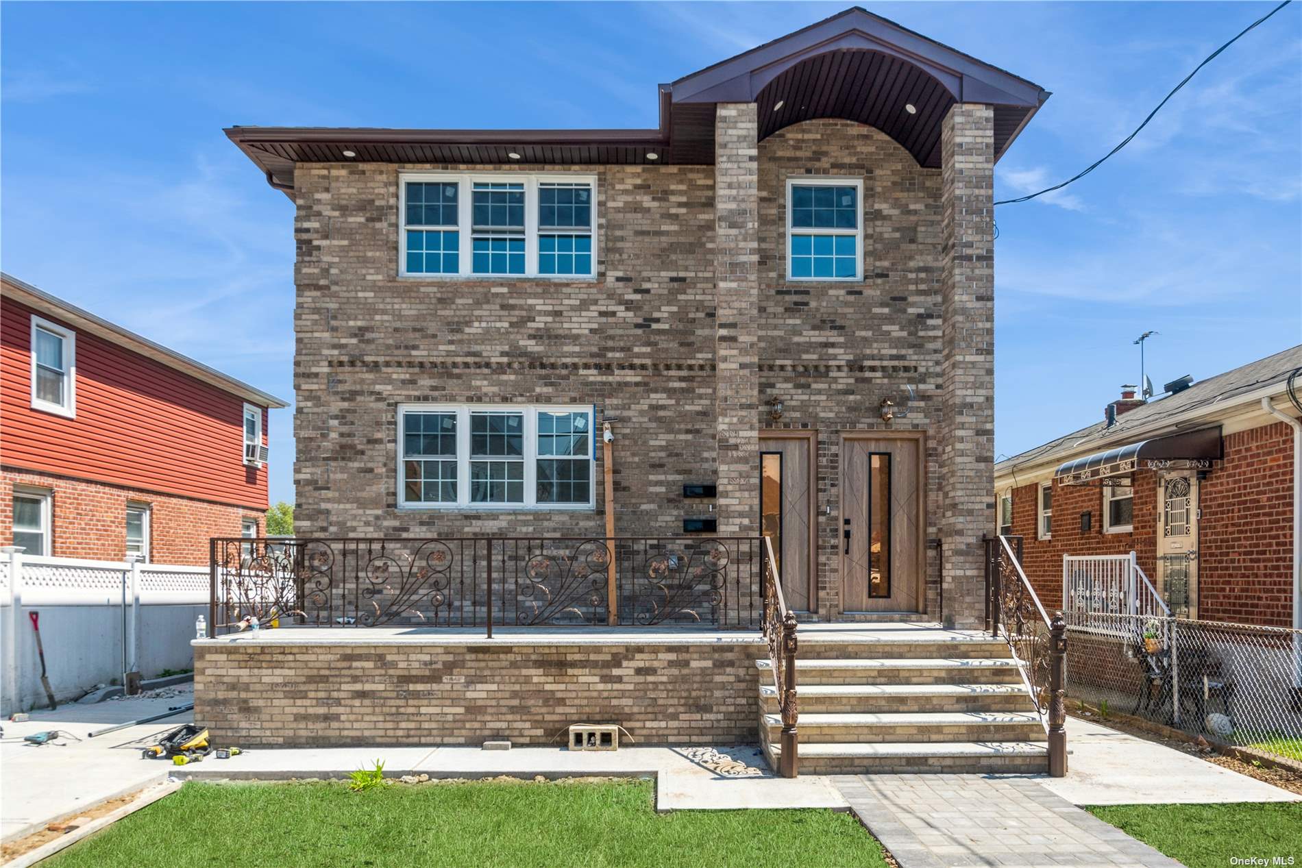 a front view of a house with a yard