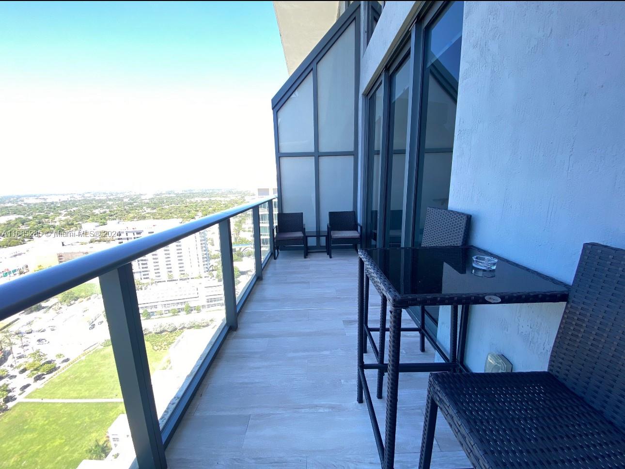 a view of balcony with furniture