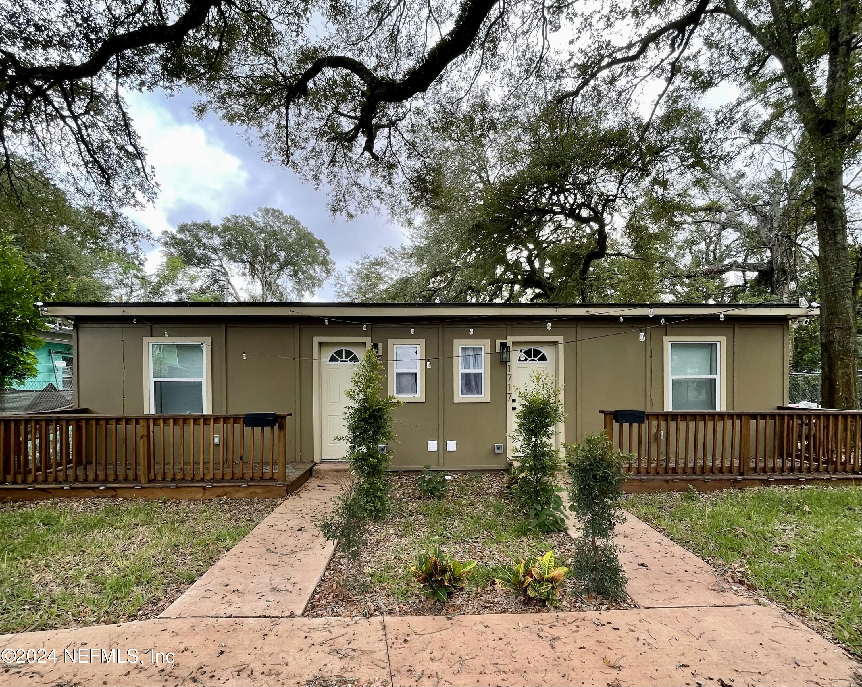 front view of a house with a yard