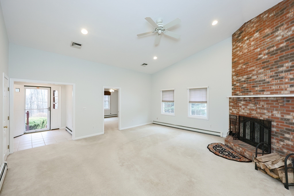 a view of livingroom with furniture and a fireplace