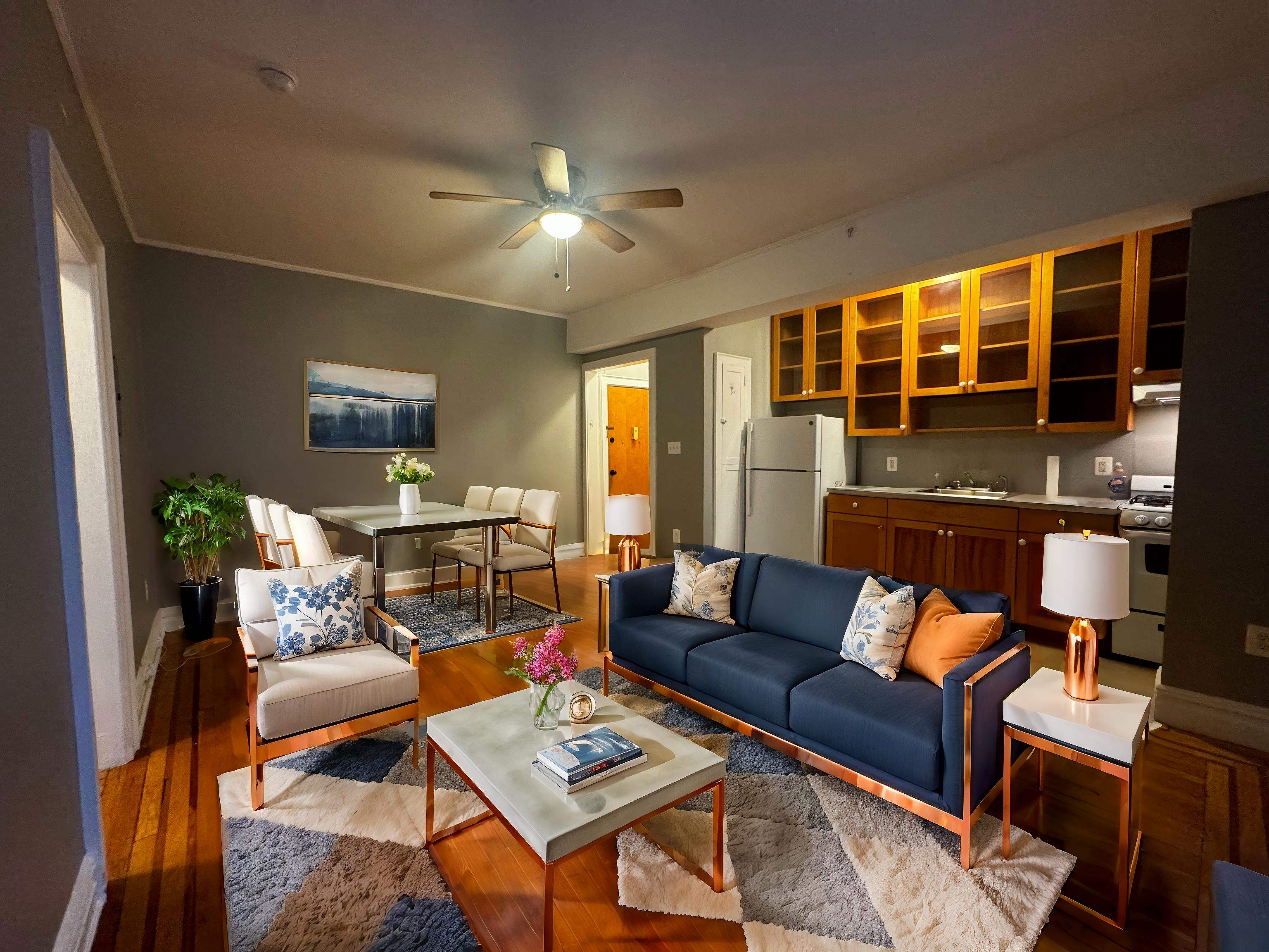 a living room with furniture and a floor to ceiling window