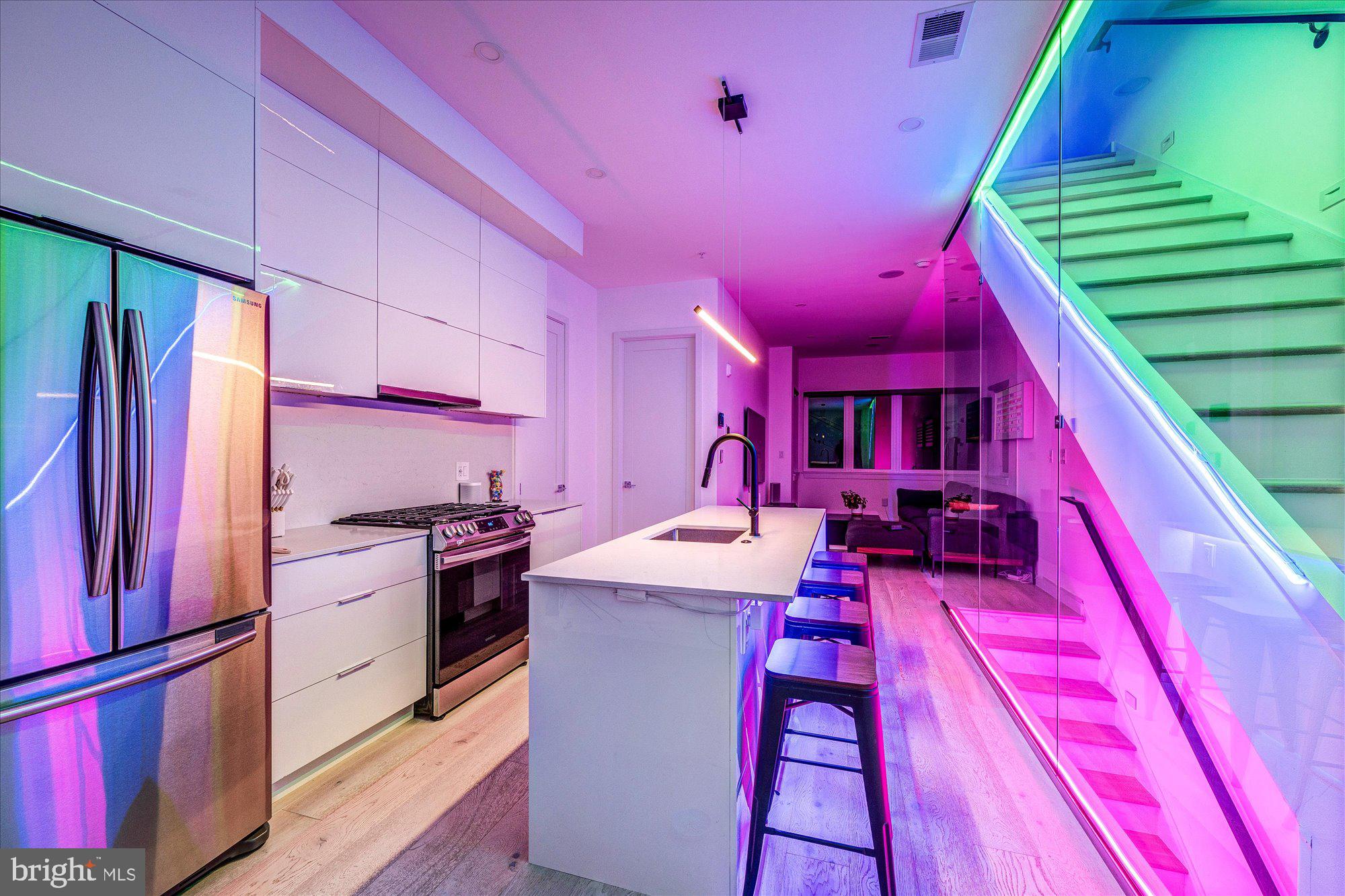 a kitchen with stove and a refrigerator