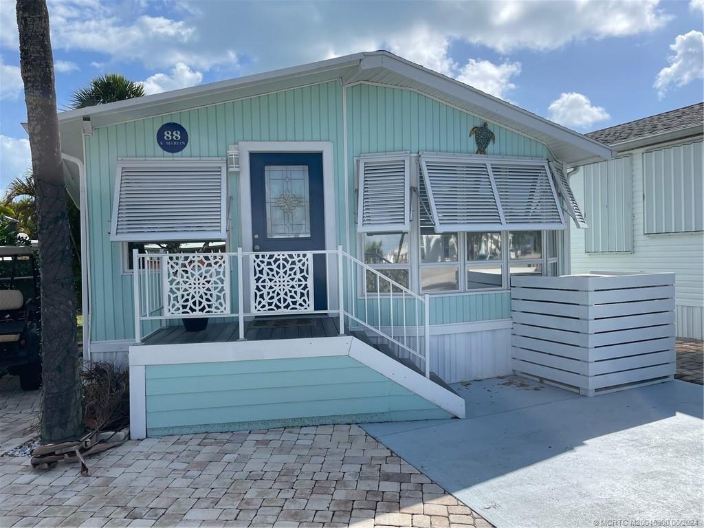 a front view of a house with a garage