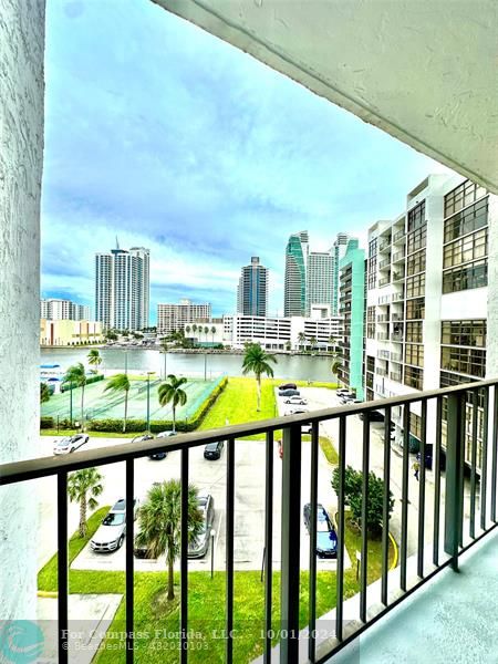 a view of tall buildings from a balcony