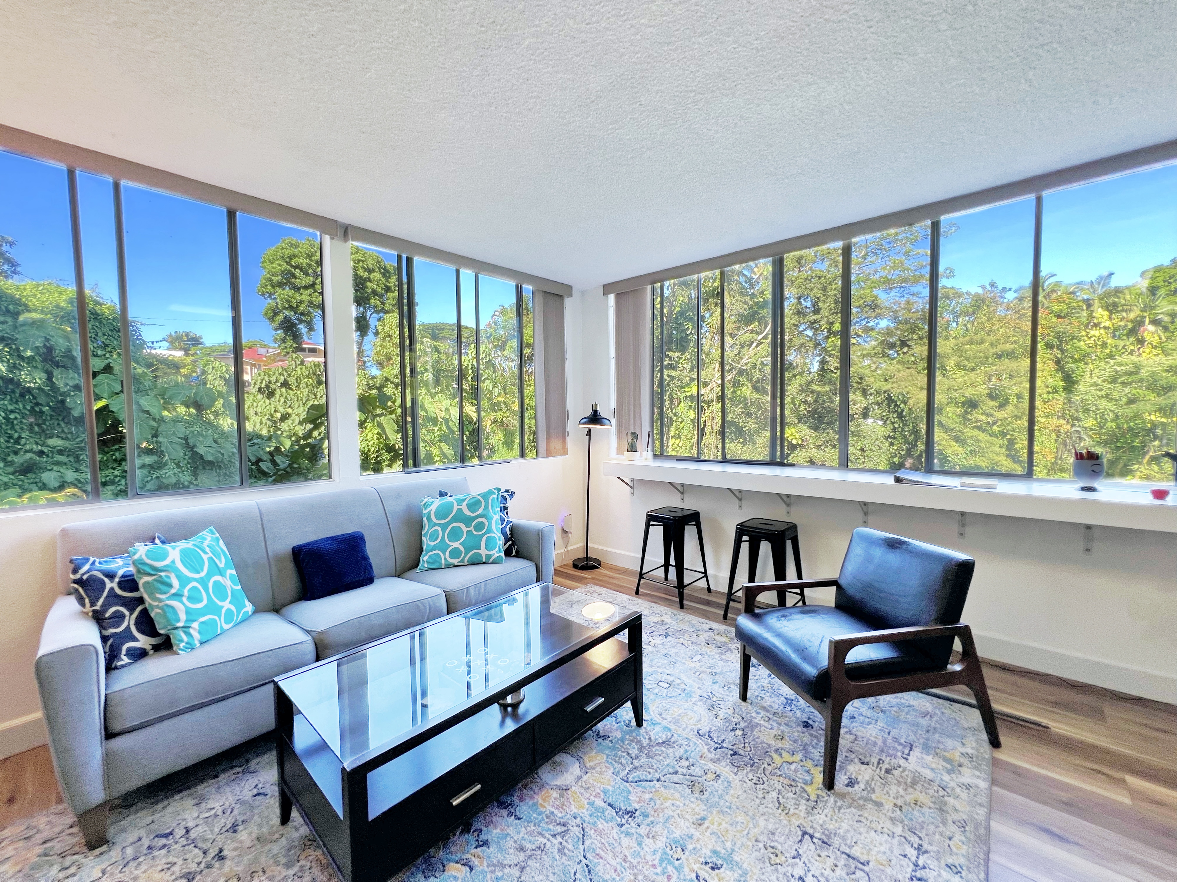 a living room with furniture and a large window